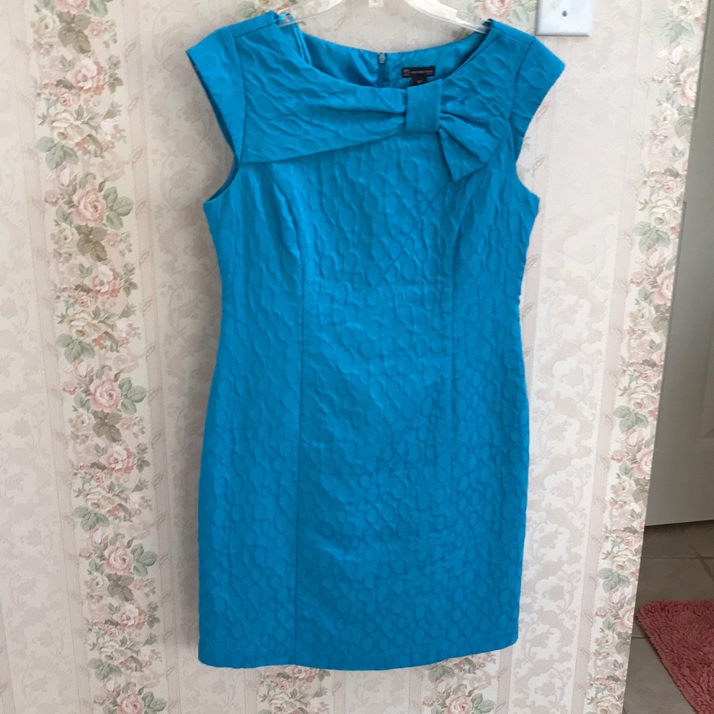 Pretty peacock blue dress with cap sleeves.